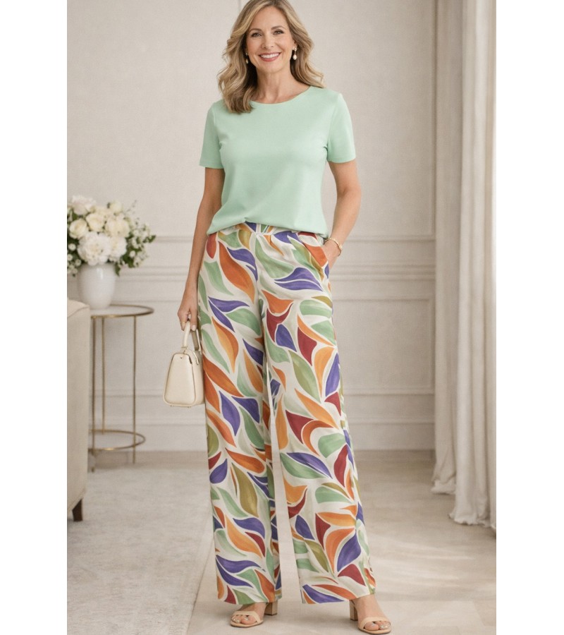 Pantalón largo bolsillos pata ancha estampado hojas