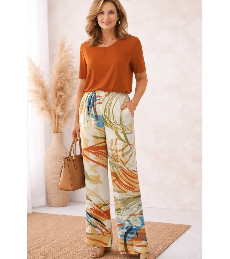 Pantalón largo bolsillos pata ancha estampado flores